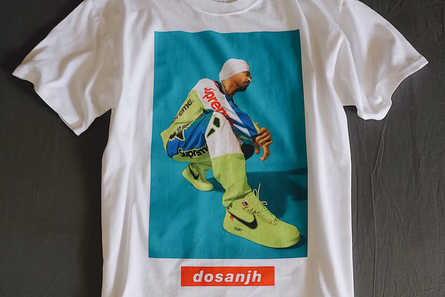 A simulated process screen print of Diljit Dosanjh on a white t-shirt.