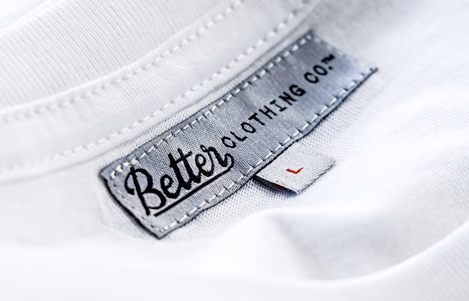 A custom woven neck label for the brand Better Clothing Co.