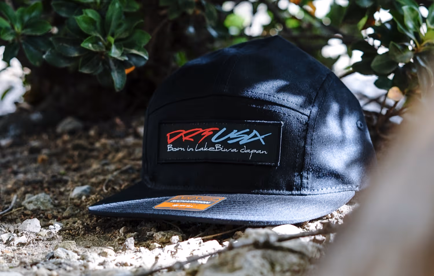 A patch hat featuring a logo for DRT USA, a brand formed in Japan.