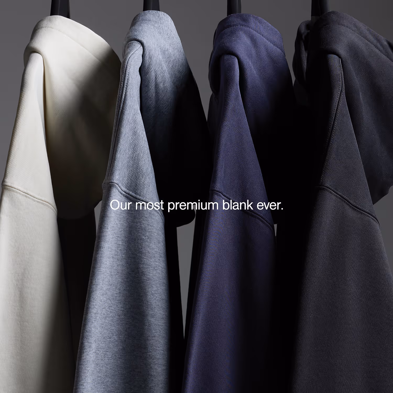 An image of 4 premium hooded sweatshirts hanging with the words "or most premium blank ever".