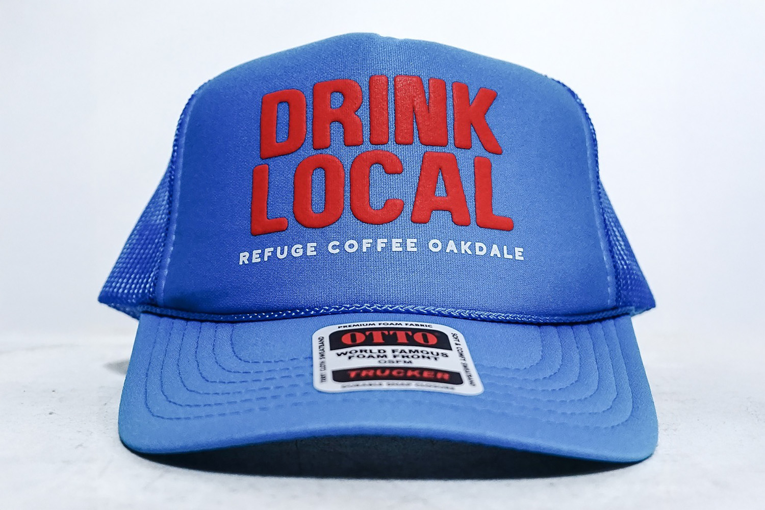 An image featuring a puff screen print on a trucker hat.