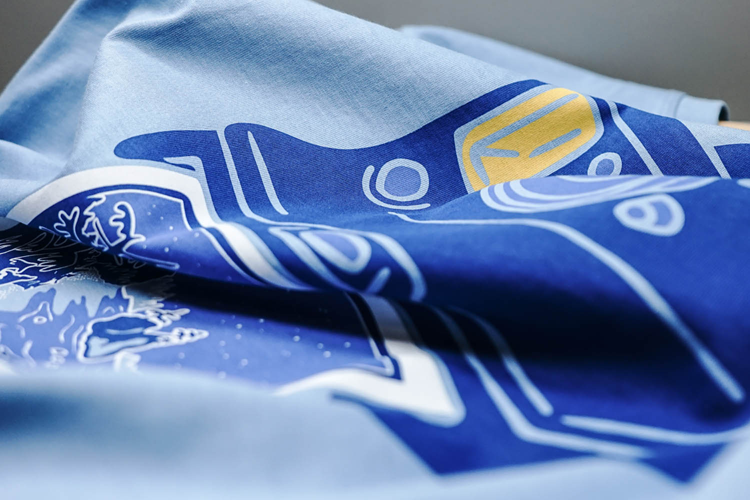 A water base screen print with ink driven deep into the fibers  of the shirt.