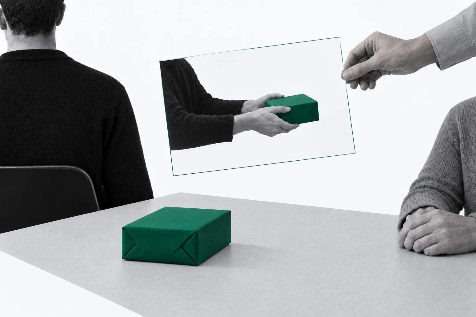 A person turns away from a green gift while a separate hand holds a transparent image of them offering it.