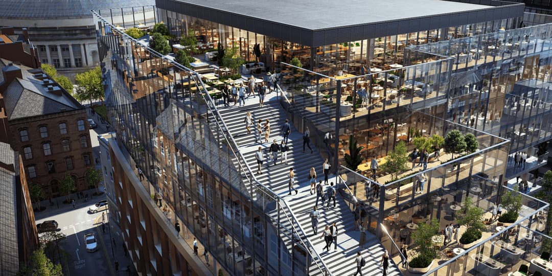 Urban office development with glass architecture, outdoor terraces, and communal stepped social spaces.