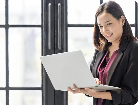 Business woman holding laptop