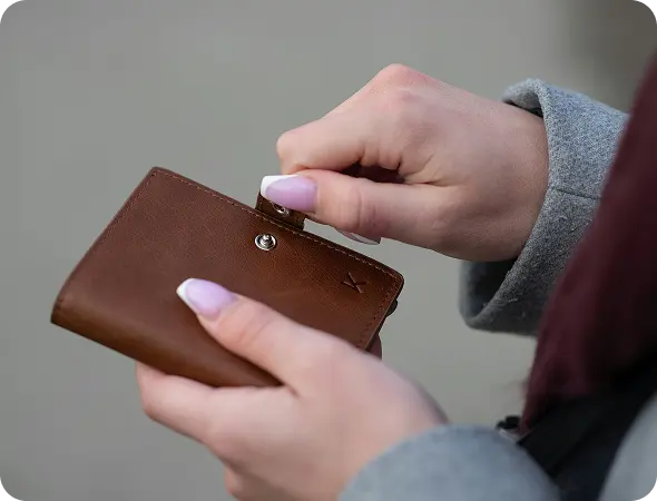 Woman opening wallet