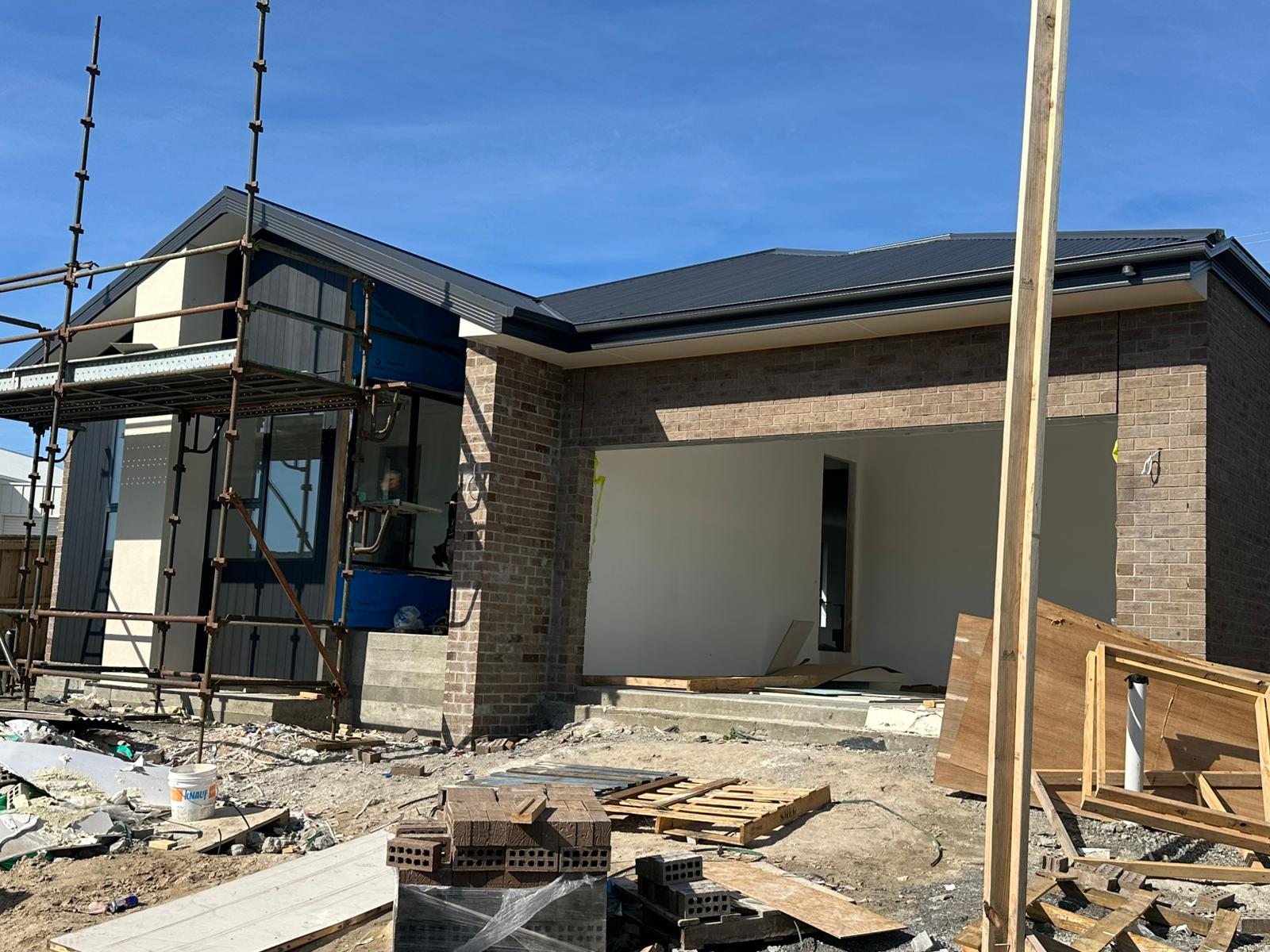 Construction progress at our Sorell residence showing the garage and recessed entrance
