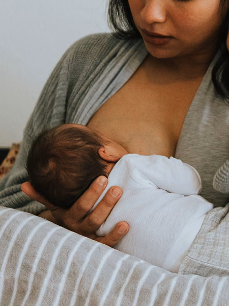 Woman breastfeeding an infant
