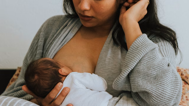 Woman breastfeeding an infant