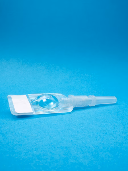 Self injectable depo provera birth control shot on blue background