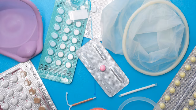 Assortment of birth control methods including pills, diaphragms, internal condoms, IUDs, and more.