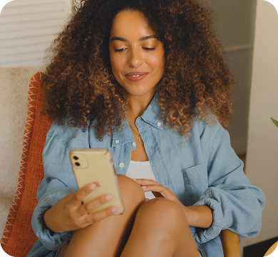 Woman researching Hey Jane, the leading virtual abortion clinic, on her phone.