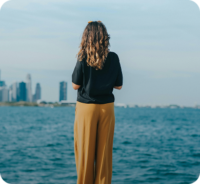Illinois woman researching Hey Jane, the leading virtual abortion clinic on-the-go overlooking Lake Michigan and Chicago's skyline.