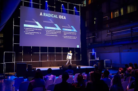 A speaker of the event on a stage of Friends of Search Friends of Search — European search conference