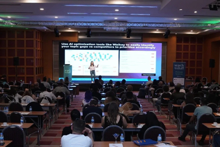 Speaker on Stage at a Leading London SEO Event Expert speaking on stage in front of a live audience