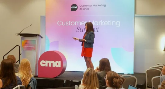 Speaker at Customer Marketing Summit presenting to the audience