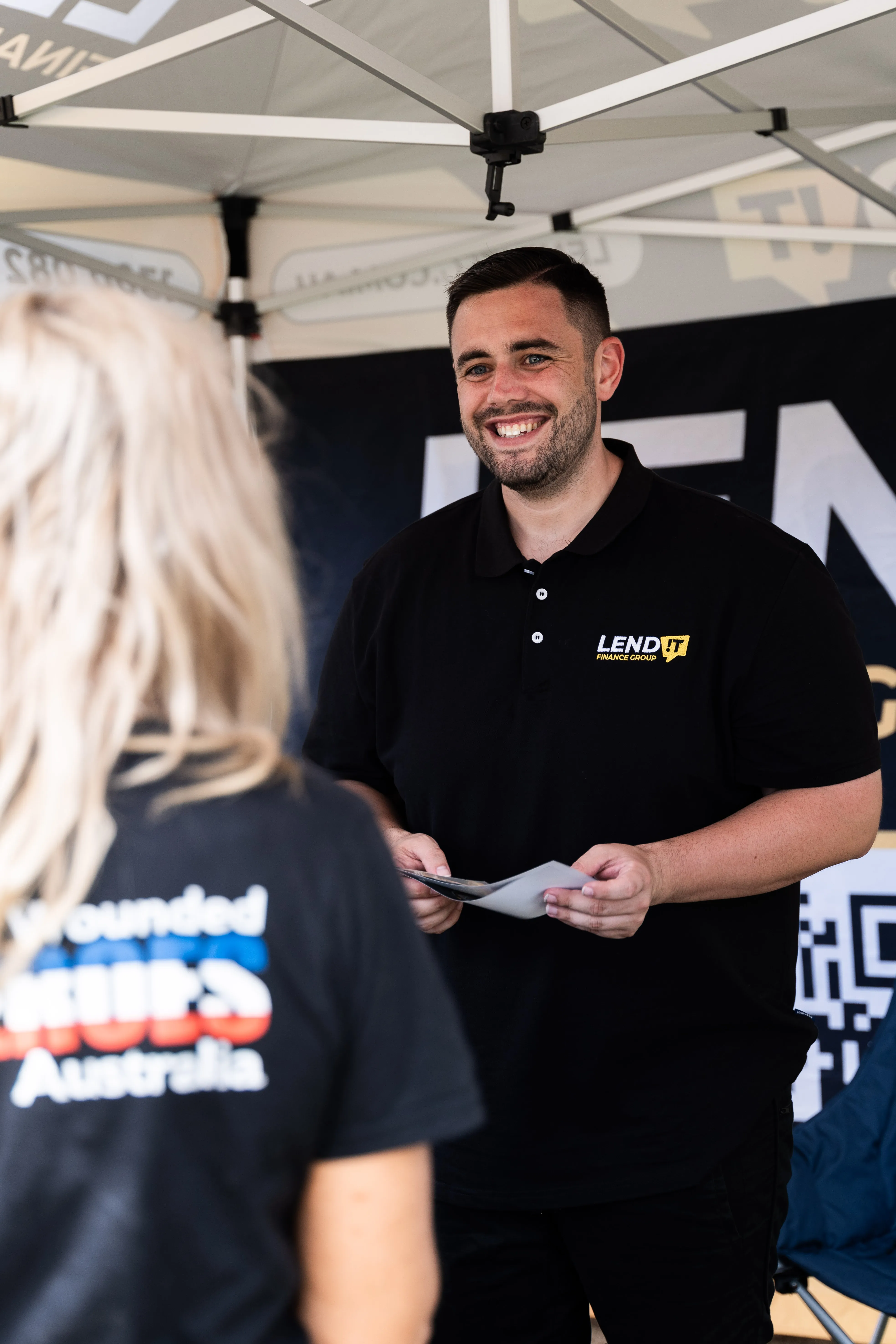 Dayle Filliponi of Lend It Finance Group chatting with a client