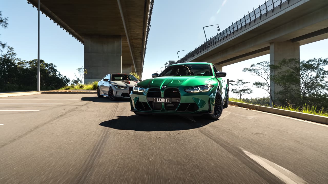 Two BMW M performance cars with LEND IT plates driving on the Gold Coast — car and asset finance, Lend It Finance Group