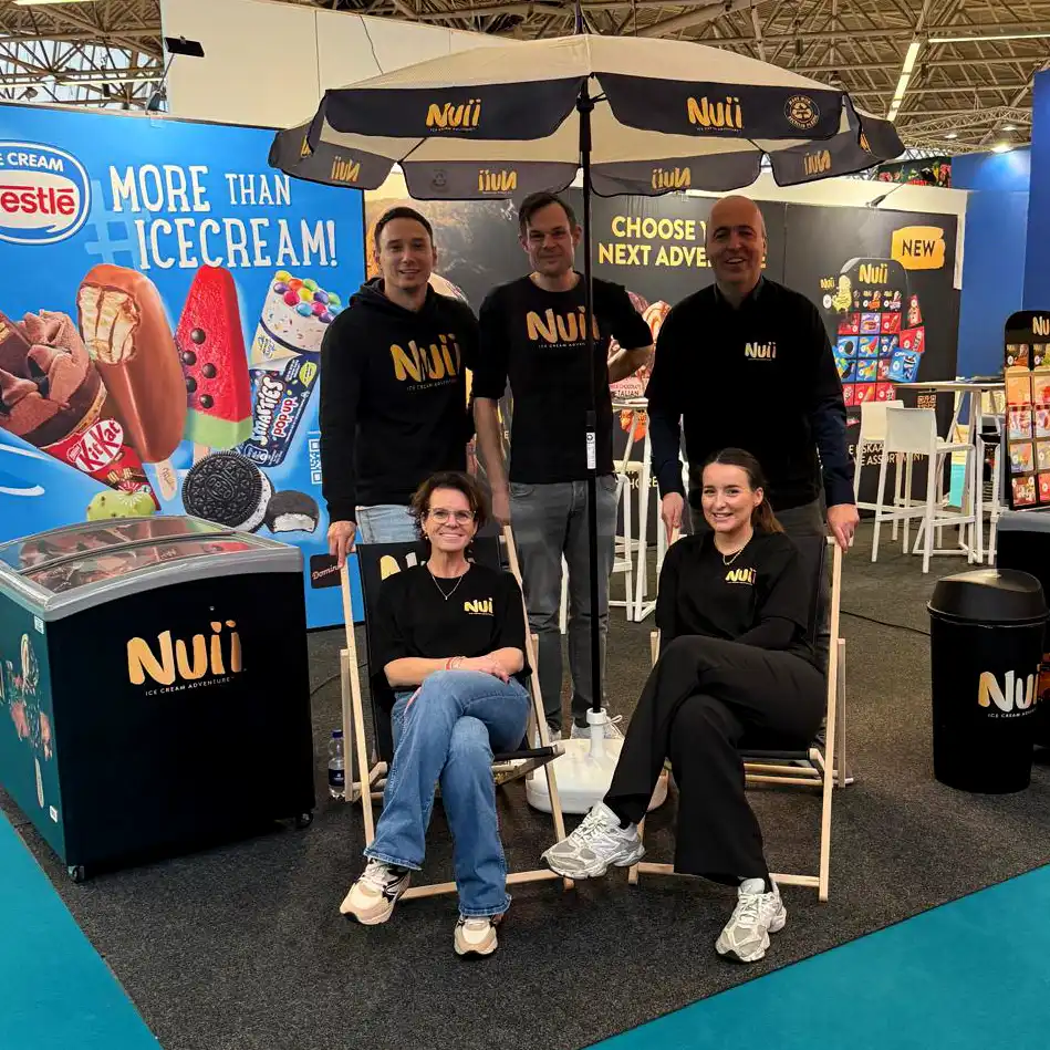 Nestlé Ice Cream logo with various Nestlé ice cream products including KitKat cone, chocolate-covered bar, watermelon popsicle, Smarties pop-up, and Oreo ice cream sandwich on a blue background.