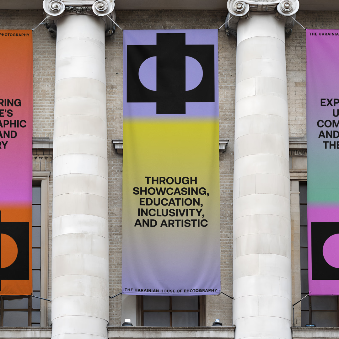 Cartoon cow holding a bottle of milk in front of a shark swimming underwater, with Ukrainian text below.