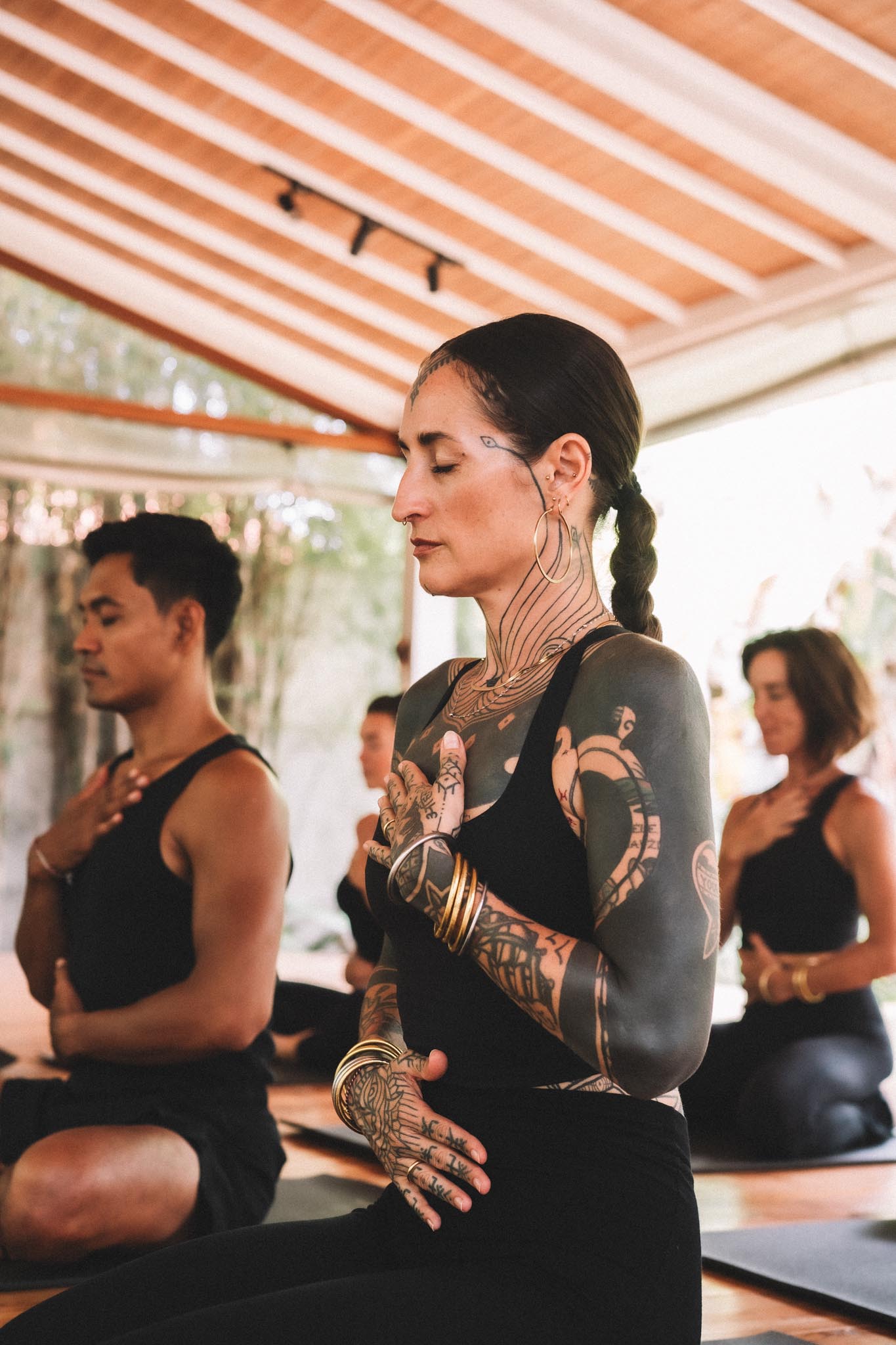 Students seated in breath awareness during a yoga class at Path Yoga Center in Canggu, Bali