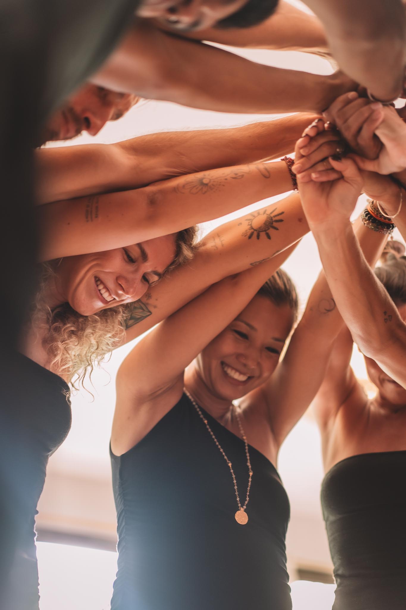 Group of participants sharing connection during a yoga community session at Path Yoga Center in Canggu, Bali