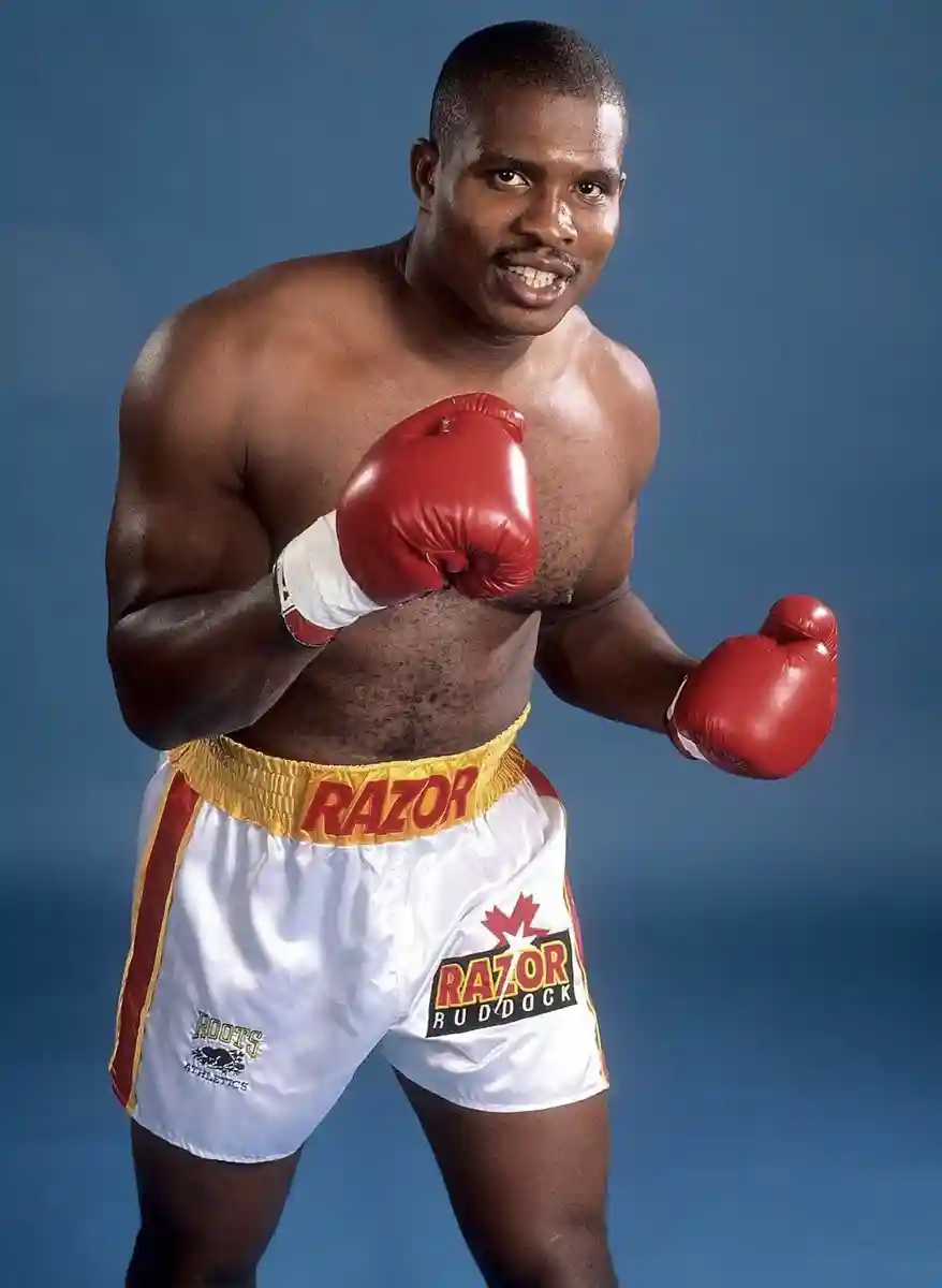 Donovan Ruddock posing in red gloves and white boxing trunks