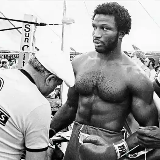 Mike Weaver holding a towel while standing in a boxing ring