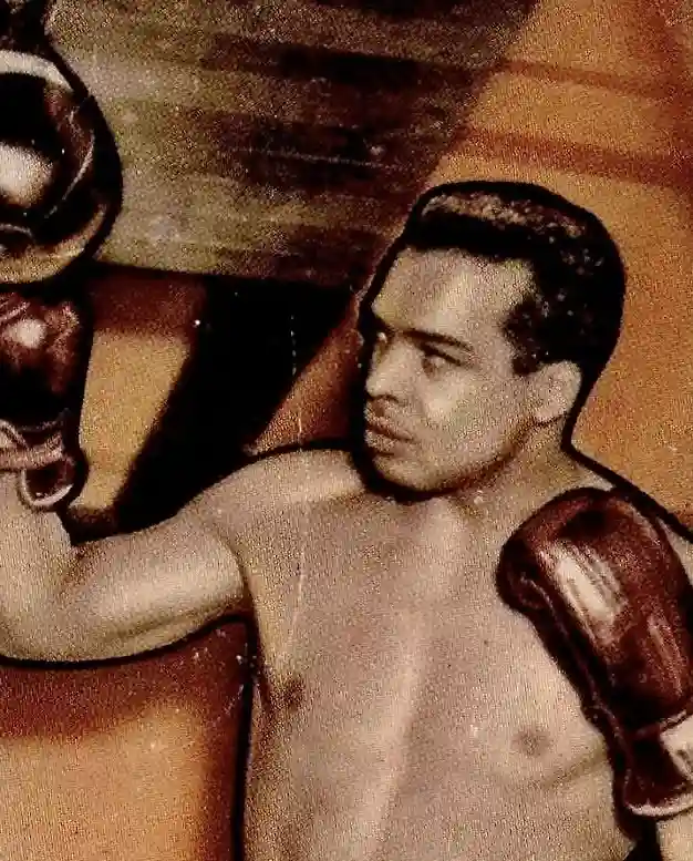 Bob Satterfield posing in dark boxing gloves