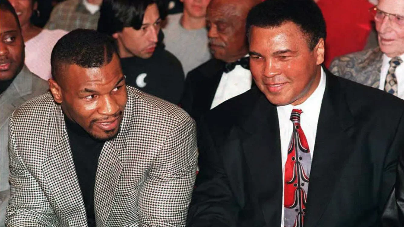 Mike Tyson alongside Muhammad Ali.