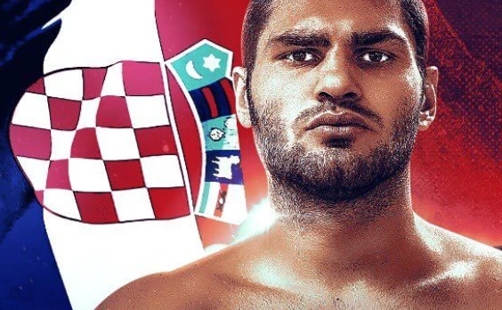 Portrait of Filip Hrgovic in front of a Croatian flag.