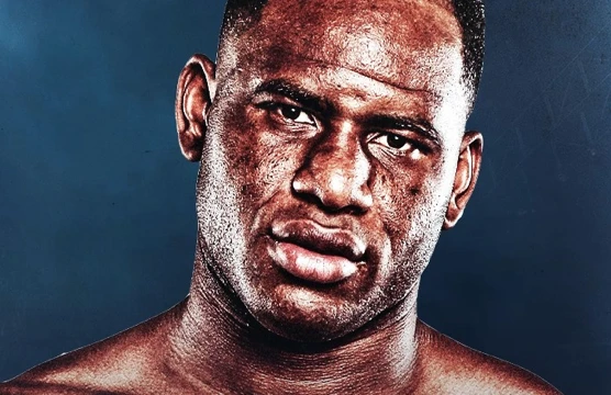 Close-up portrait of Frank Sanchez against a dark blue background.