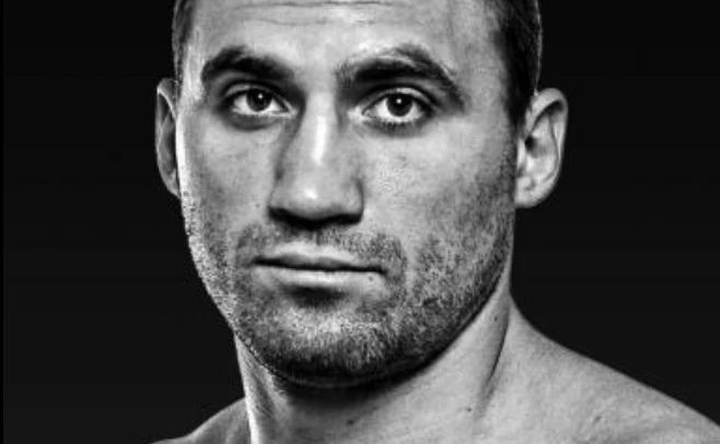 Black-and-white close-up portrait of Viktor Faust.