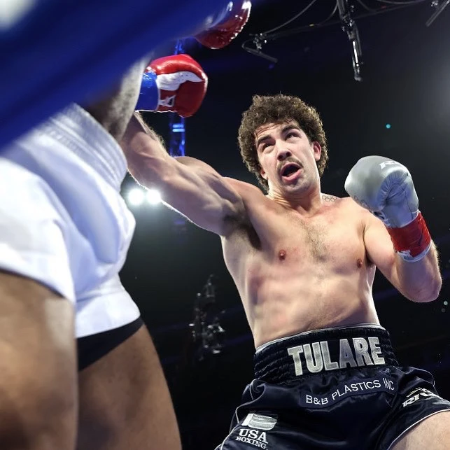 Richard Torrez Jr. extends a punch toward an opponent in the ring.