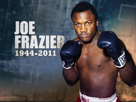 Joe Frazier poses with boxing gloves in a tribute graphic marked 1944–2011.