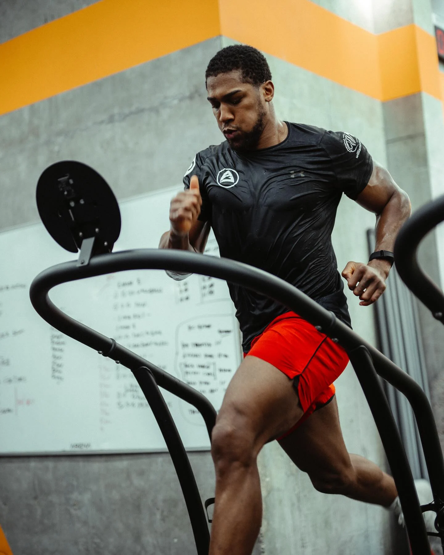 Anthony Joshua running on a treadmill during training