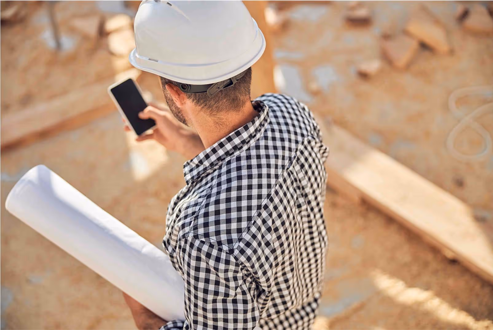 Contractor taking a phone call to provide customer support.