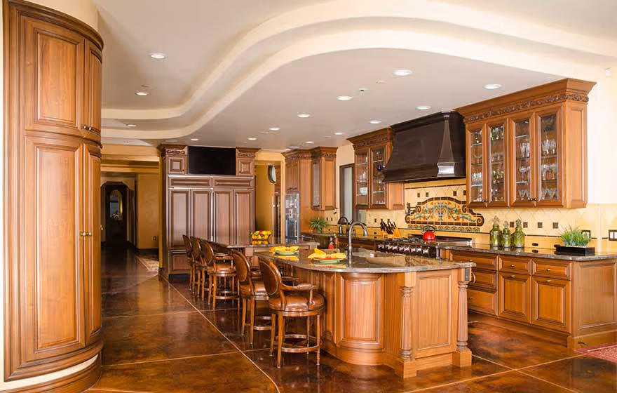 Traditional brown wooden cabinets in a classy kitchen