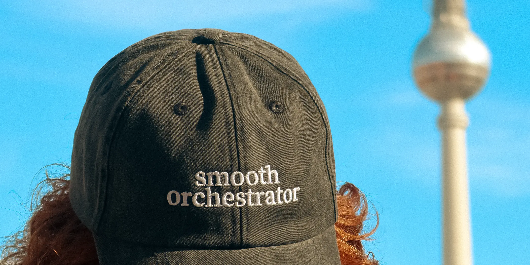 Payrails blog cover image Smooth Orchestrator hat with Berlin TV tower in the background