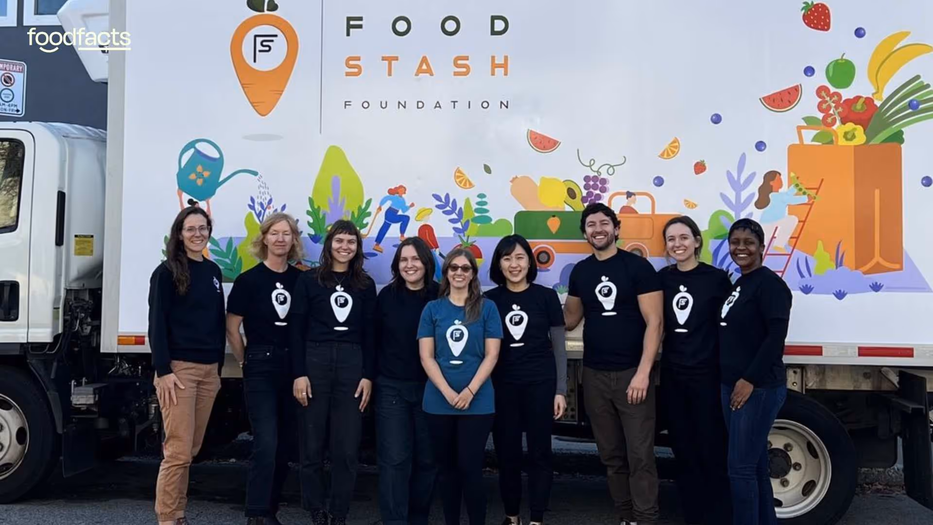 A group of smiling people stands in front of a Food Stash Foundation truck featuring colorful, illustrated produce and community-themed artwork, suggesting a shared mission focused on food rescue and sustainability.