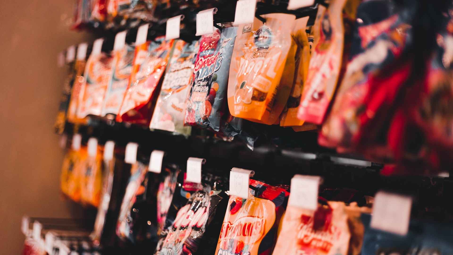 Packets of sweets on a shelf