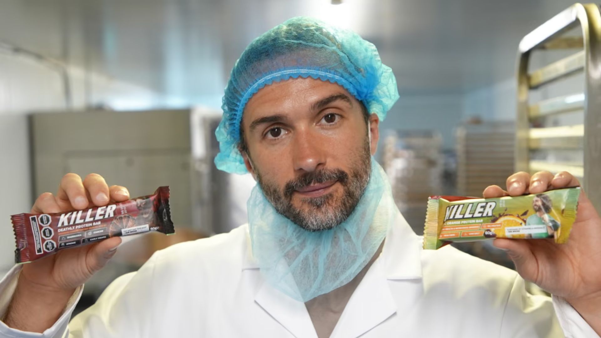 Joe Wicks holds two of his killer bars