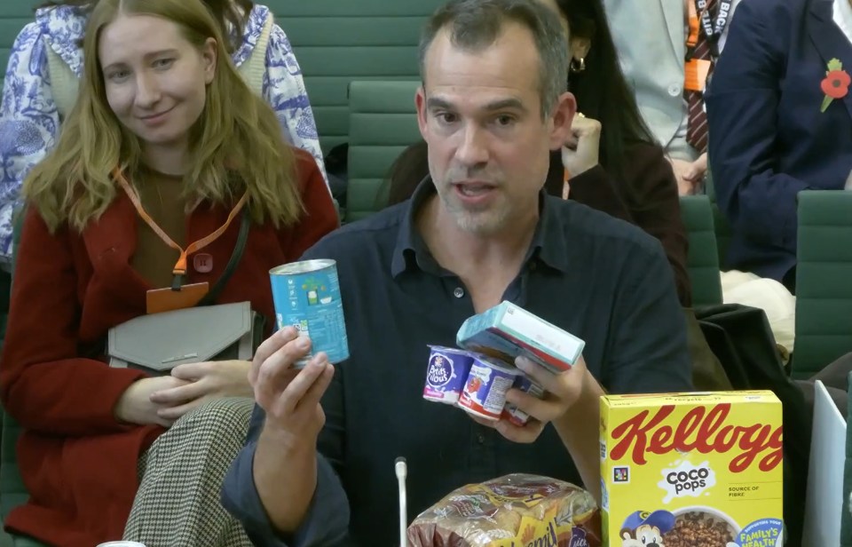 Dr Chris van Tullekan holds a tin of baked beans and yogurt in his hands