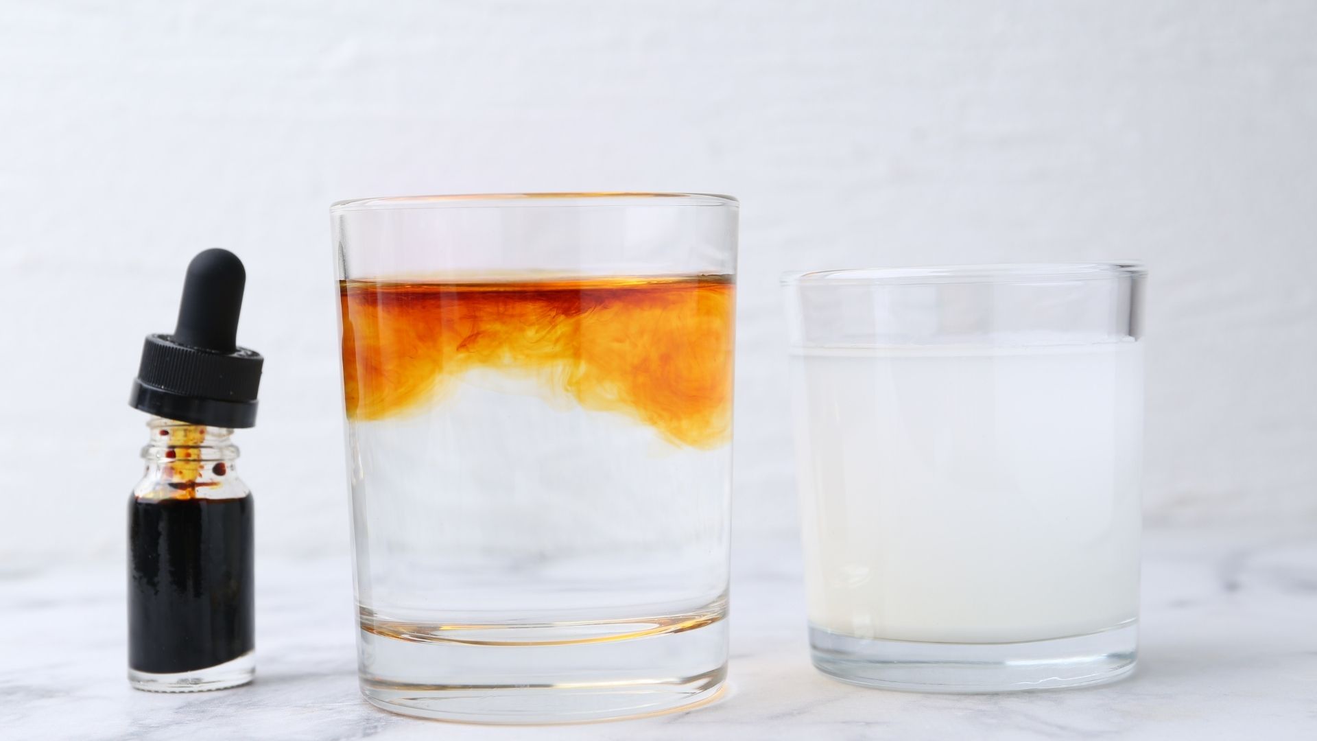 A glass of water has drops of iodine added