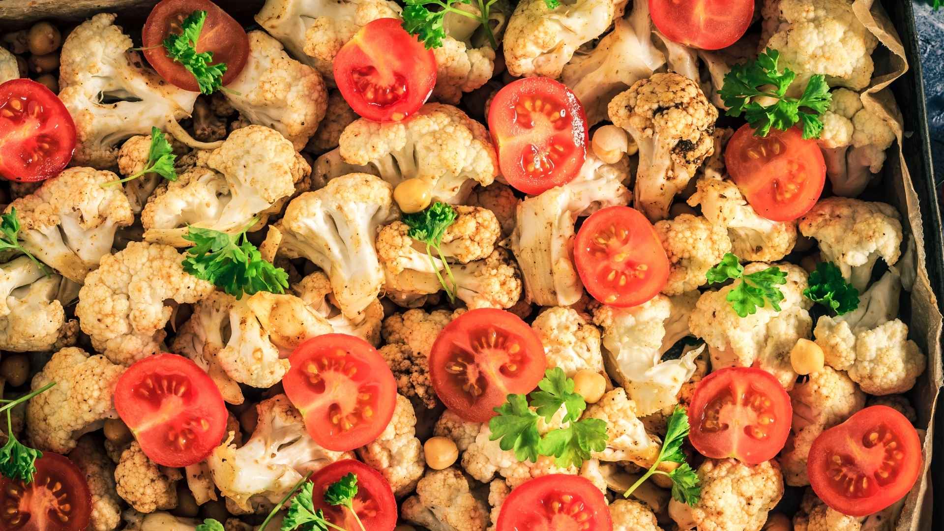 A tray of roasted cauliflower and tomatoes