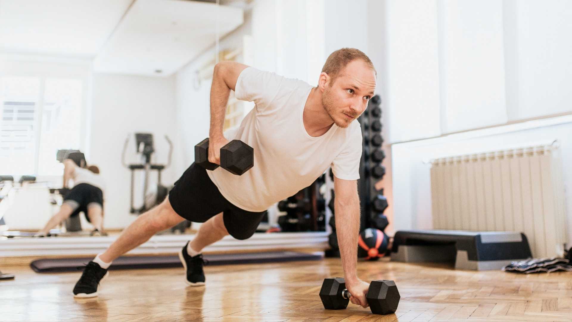 A person does exercise in a gym