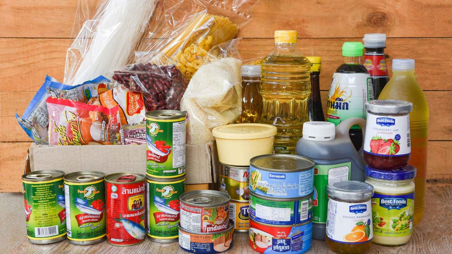 A batch of different tinned and packaged food