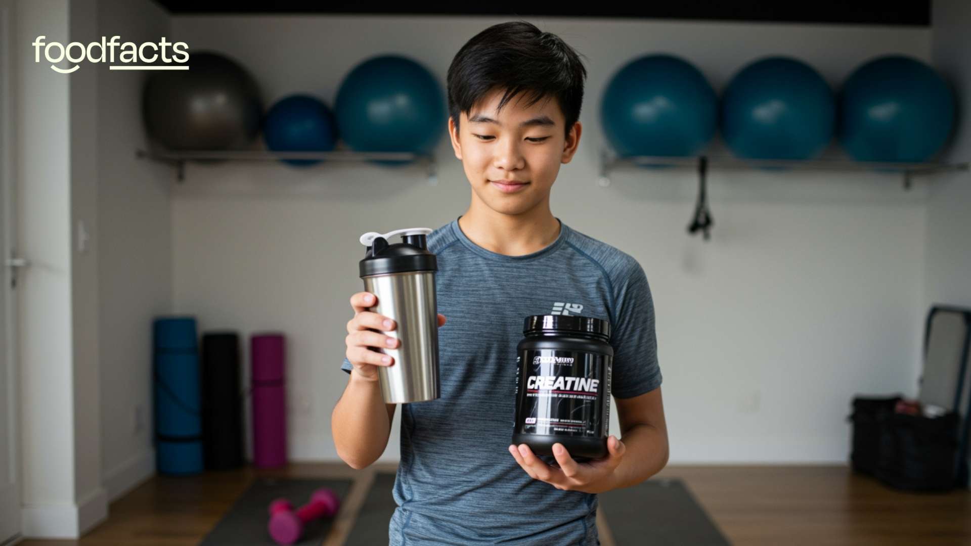 A teenage boy holds a shaker bottle of creatine and water. He is standing inside of a gym. This image highlights the high prevalence of creatine use amongst teenagers.