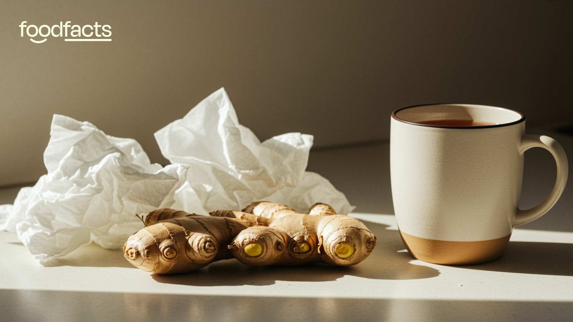 A man holds some ginger in his hands whilst looking unwell.