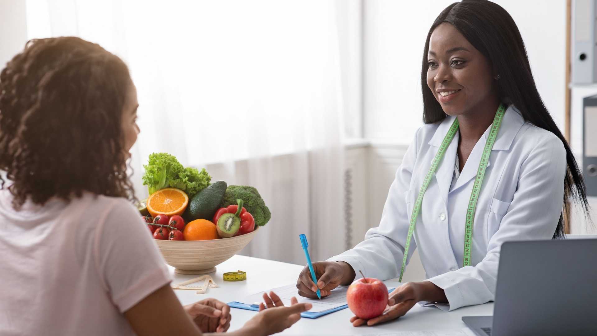 A dietitian assists their patient